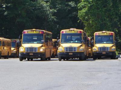 Buses lined up at the East Hampton School District's depot on Route 114, which the district leases.