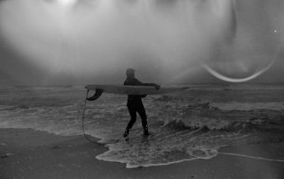 Lisa Spellman, about to set off in Montauk during Saturday’s snowstorm, finds surfing to be “an amazing equalizer.”