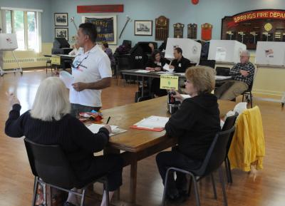 Voters cast presidential primary ballots at the Springs Firehouse on Tuesday. Here in the First Congressional District, Republicans supported Donald Trump by a wider margin than elsewhere in the state; while Hillary Clinton's victory in the Democratic contest was narrower than elsewhere in New York.