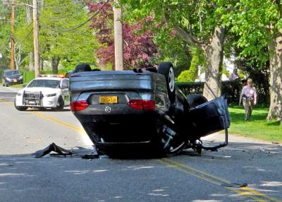 The driver of a car that flipped and landed on its roof in East Hampton on Wednesday afternoon was airlifted to Stony Brook University Hospital.