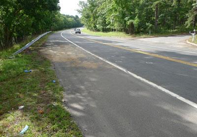 Debris and emergency medical supplies remained at the site of Sunday's fatal, two-vehicle accident on Route 114 in East Hampton