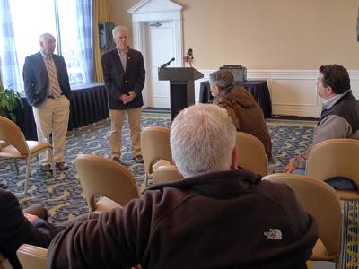 Suffolk Executive Steve Bellone, center, and County Legislator Jay Schneiderman spoke with a group of Montauk residents and business owners on Wednesday during a daylong visit to the East End.