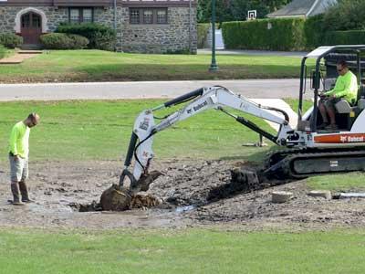 A water pollution-trapping project on the Village Green in East Hampton is being modified after it was found to have been improperly designed for the soil condition there.