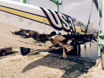 A collision with a steel buoy left a long gash in the port side of the race boat Stuart Haymim and Joey Imprescia were riding in during their record attempt.