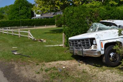 A truck parked in a driveway on Bluff Road was demolished when a Mercedes flipped over, bounced off of it, and flipped over again early Saturday morning.