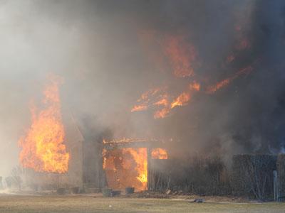 High winds quickly dashed any hope of saving an oceanfront house that caught fire and burned to the ground on Wednesday.