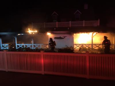 Furniture refinishing and stripping products are believed to have caused a fire that damaged an outside wall at Gosman’s Dock in Montauk on Friday night.