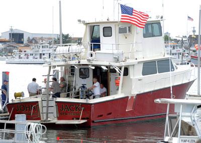 A 64-year-old diver died aboard the John Jack Thursday while on a trip to explore a World War II-era shipwreck.