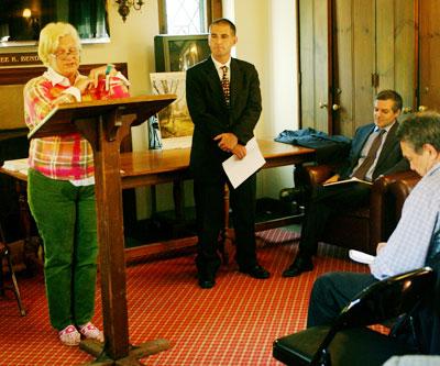 Doreen Niggles, the president of the East Hampton Library board, spoke Thursday about its victory in a lawsuit over East Hampton Village, which had sought to block its children's' room expansion. Dennis Fabizak, the library's director, at rear, waited his turn to speak.