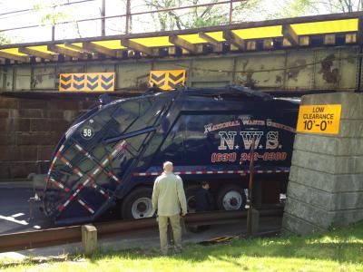 A National Waste Services garbage truck hit the North Main Street overpass on Tuesday morning.