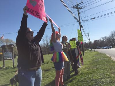 Lisa Votino-Tarrant, Zoia Foster, Bob Zelner, and the Rev. Dr. Katrina Foster displayed signs in support of marriage equality on Tuesday afternoon at Incarnation Lutheran Church.