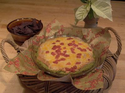 Baked in a glass pie dish and served nestled in a basket with a festive napkin, seven-layer dip is an easy party dish for any season.