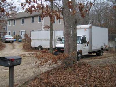 Pickup trucks with commercial or standard registration — and which do not have business signs or logos on them — would not be regulated, though panel trucks like these in East Hampton and others could be.