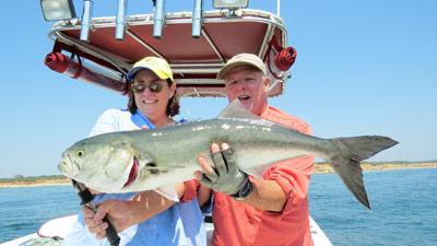 Capt. Ken Rafferty helped Patrice Neil of East Hampton hoist the 12-pound bluefish she caught off Montauk last week.