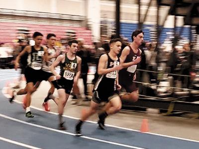 Ryan Fowkes, above at right and below center, racing to a second-place finish in the 1,000 meters at the state qualifier meet at Suffolk Community College-Brentwood last week.