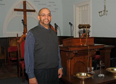 The Rev. Michael Jackson leads the Triune Baptist Church, which recently took up temporary quarters for services in a historic Sag Harbor church.