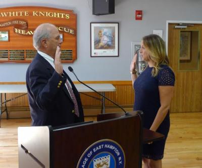 Rebecca Molinaro, the village clerk, swore in Arthur Graham to the East Hampton Village Board, on Wednesday.