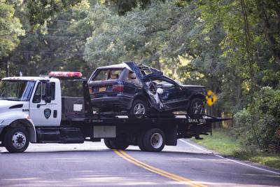 The Land Rover that crashed into the woods in Springs on Wednesday morning was taken away by a tow truck and impounded.