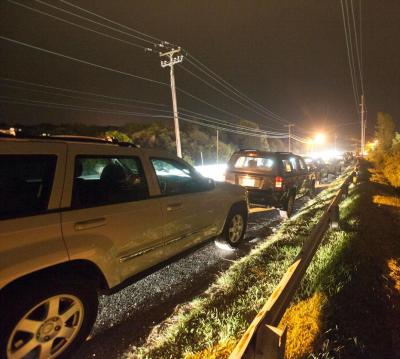 Cars parked on South Edgemere Road on a busy summer night outside The Surf Lodge in Montauk New York