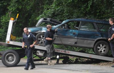 Alvarado Mechanical towed the car that rolled over on Three Mile Harbor Tuesday morning, leaving one injured.