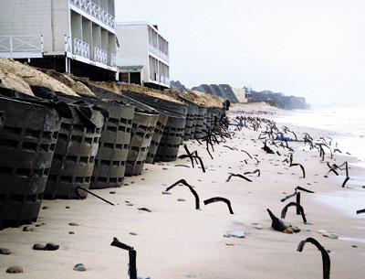 Concrete “rings” placed in front of the Royal Atlantic Resort after Hurricane Sandy and a subsequent storm and long-buried metal fence stakes were exposed by last week’s destructive northeaster.