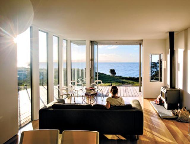 Every room in the 1,250-square-foot house David Berridge designed for his family on the coast of New Zealand has an ocean view.