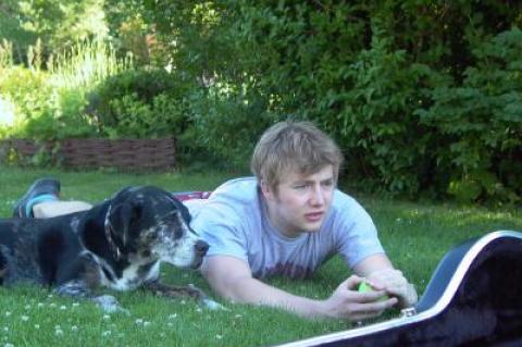 The author's son, Billy Taylor, who makes a mean salad dressing, with their dog Gumbo from earlier days