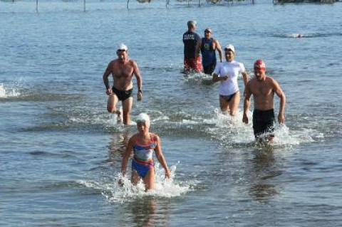 With Julia Brierley leading the way, the half-milers exited the water.