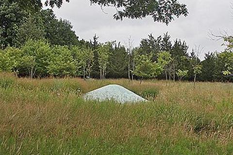 A sculpture of blue-glass pebbles by Maya Lyn is a centerpiece of Edwina von Gal’s garden, featured in Guild Hall’s Garden as Art tour on Saturday.