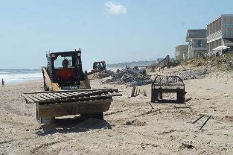 Flotsam, fencing, and all manner of debris were taken off the beach in front of Montauk’s motel row on Monday.