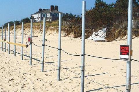 A Georgica Beach property owner has been cited by East Hampton Village and the State Department of Environmental Conservation for fencing off a section of ocean beach.