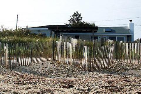 Eileen Raffo’s cottage at Lazy Point sits low and is vulnerable to storm surges. Ms. Raffo wants to raise the house on a new, higher foundation, but the town trustees are not sure that’s a good idea.