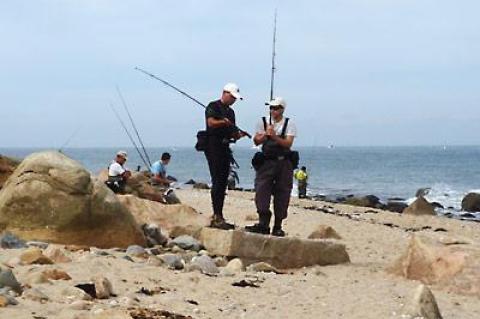 Surfcasters discussed equipment during a break in the action at Montauk Point on Sunday.