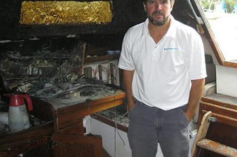 David Ryan, founder of Sailing Montauk, stood inside the charred cabin of his Catalina 38, which was struck by lightning in August.