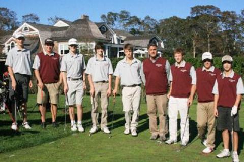 East Hampton’s golfers, shown above with their coach, Claude Beudert, in front of the East Hampton Golf Club’s clubhouse, are, from left, Matt Griffiths, Cameron Yusko, Ian Lynch, John Pizzo, Riley McMahon, Jim McMullan, Andrew Winthrop, and Andrew Davis.