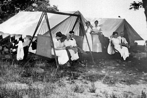 Edith Banister Huntting, third from right, and her fellow campers on Three Mile Harbor in 1910.