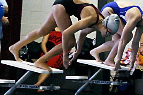 Mikayla Mott, about to plunge in above, was one of Bonac’s record-setters in the meet here with Hauppauge last Thursday.