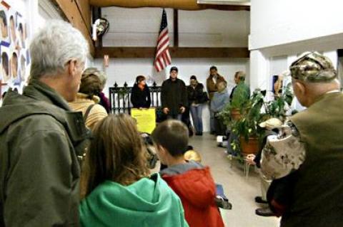 Organizers of an Occupy the Hamptons protest in Sag Harbor Sunday afternoon moved a meeting indoors because of a cold wind blowing from the north.