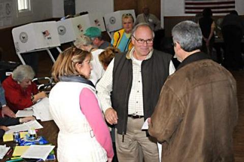 Richard Haeg, center, a Republican candidate for East Hampton Town Board, was at the Neighborhood House in East Hampton to vote on Tuesday.