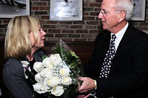 East Hampton Town Supervisor Bill Wilkinson as he surprised his wife, Pat, with a dozen white roses toward the end of Tuesday night’s post-election party.