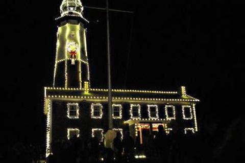 Msgr. Peter Anthony Libasci had the honor of flipping the switch that ignited 3,777 lights on the Montauk Lighthouse.