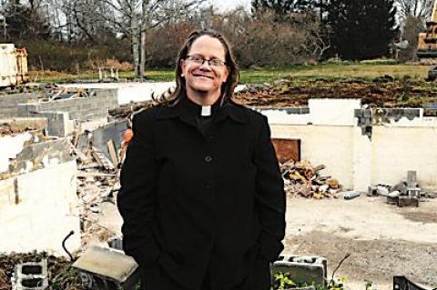 The Rev. Katrina Foster of St. Michael’s Lutheran Church in Amagansett stood in front of the demolished parsonage that will be the site of 40 units of low-income housing for senior citizens to be completed within the next year.