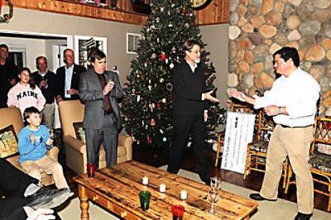 The Rev. Steven E. Howarth of the Amagansett Presbyterian Church accepted a check for $8,729 from Tim Walters, master of the Star of the East Lodge No. 843, at its annual Toys for Tots Christmas party, to help rebuild Scoville Hall, which was destroyed in a fire.