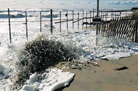 Recent storms have swallowed a big portion of Georgica Beach and focused attention again on an apparently illegally installed fence, which is partially underwater during exceptionally high tides.