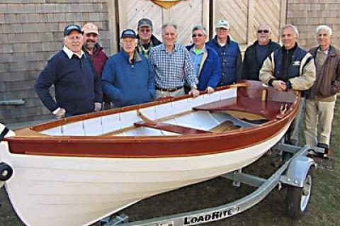 Jonathan Russo of Shelter Island (in plaid) was the winner of the East End Classic Boat Society’s 2011 fund-raising raffle. His prize was a Sunshine tender and trailer made by the group’s members, some of whom were on hand Saturday when Mr. Russo came to get the boat.