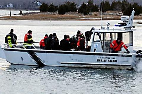 Divers from five fire departments, and the East Hampton dive team, joined forces to search for Hasley L. Dickinson, who drove his car into the cold water of Three Mile Harbor on Jan. 4.