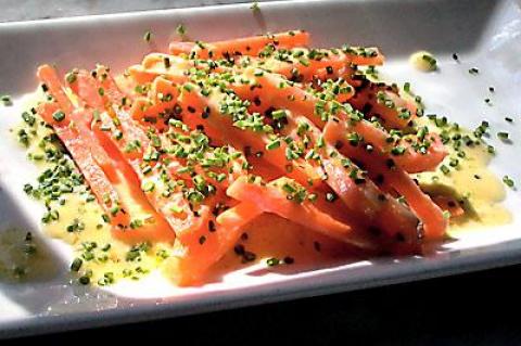 Try the carrots blanched, then sautéed with a bit of butter and topped with minced chives.