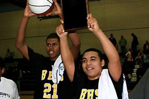 Caanan Campbell and Bump Hemby held the county championship ball and plaque aloft.