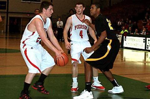 Forrest Loesch, with the ball at left, was Pierson’s hero in the county Class C semifinal and final games.