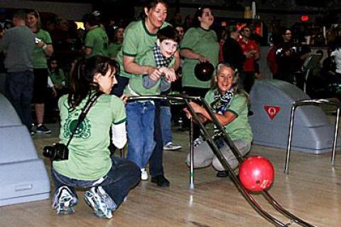 Luke Brierley, 11, shown with Lisa Lawler, Pam Carroll, and Vanessa Edwardes, all of the John M. Marshall Elementary School, was the winner in the male 8-to-11-year-old division.